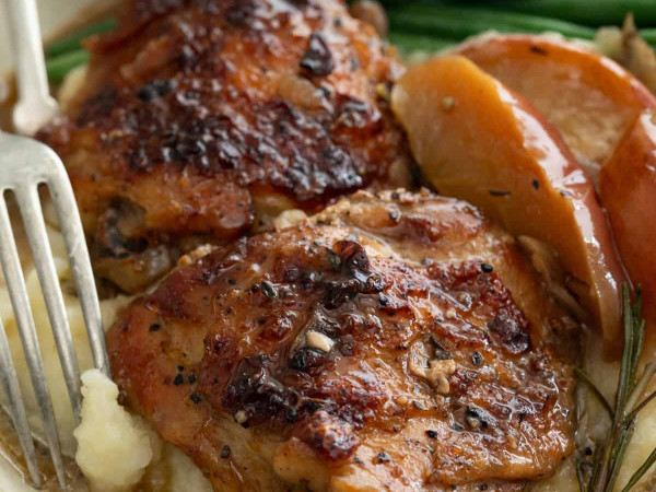 Braised Chicken Thighs Served with Apples, Bacon Chutney, and Roasted Potatoes