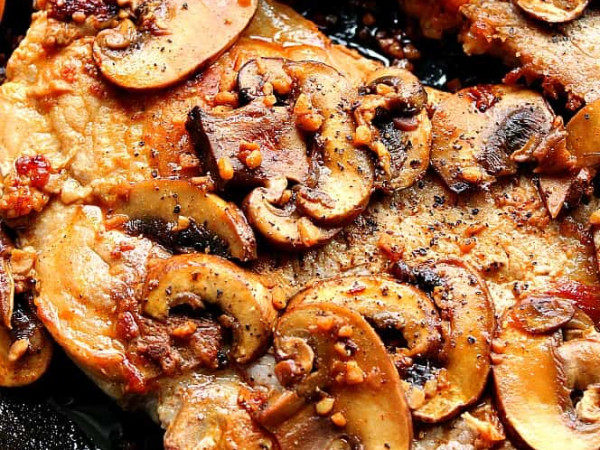 Sautéed Pork and Mushrooms in a Skillet