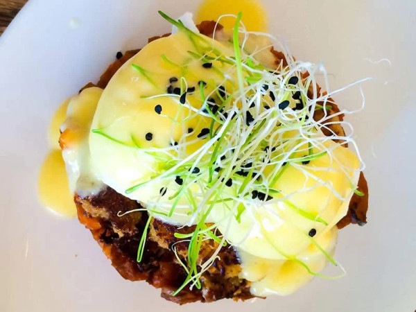 Tasty Eggs Benedict with Savory Bacon and Crab Bread Pudding