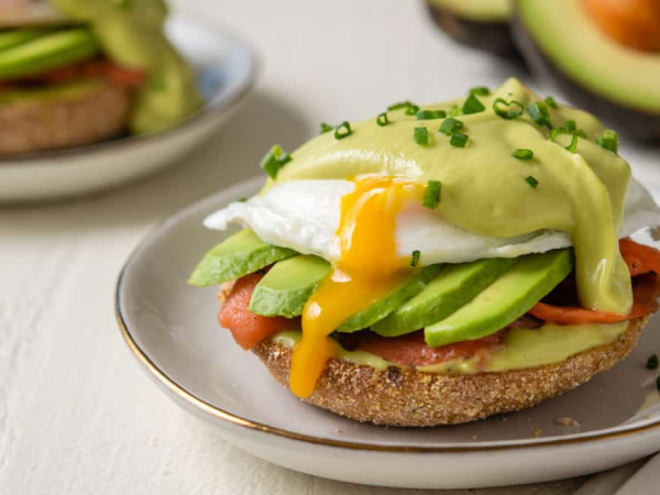 White Cheddar Hollandaise Topped Sausage and Avocado Benedict