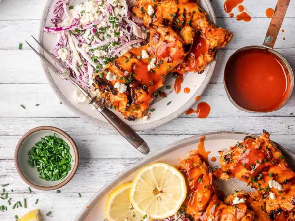 Grilled Buffalo Chicken Thighs Served with Blue Cheese Slaw