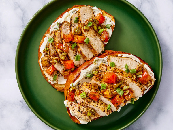 Oven-Baked Spicy Chicken Served with Cheese Grits and Chorizo Drizzle