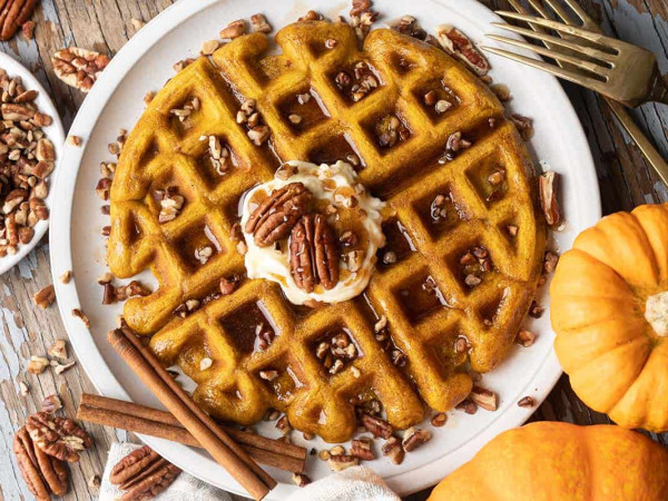 Pumpkin Waffles Topped with Flavored Maple Syrup